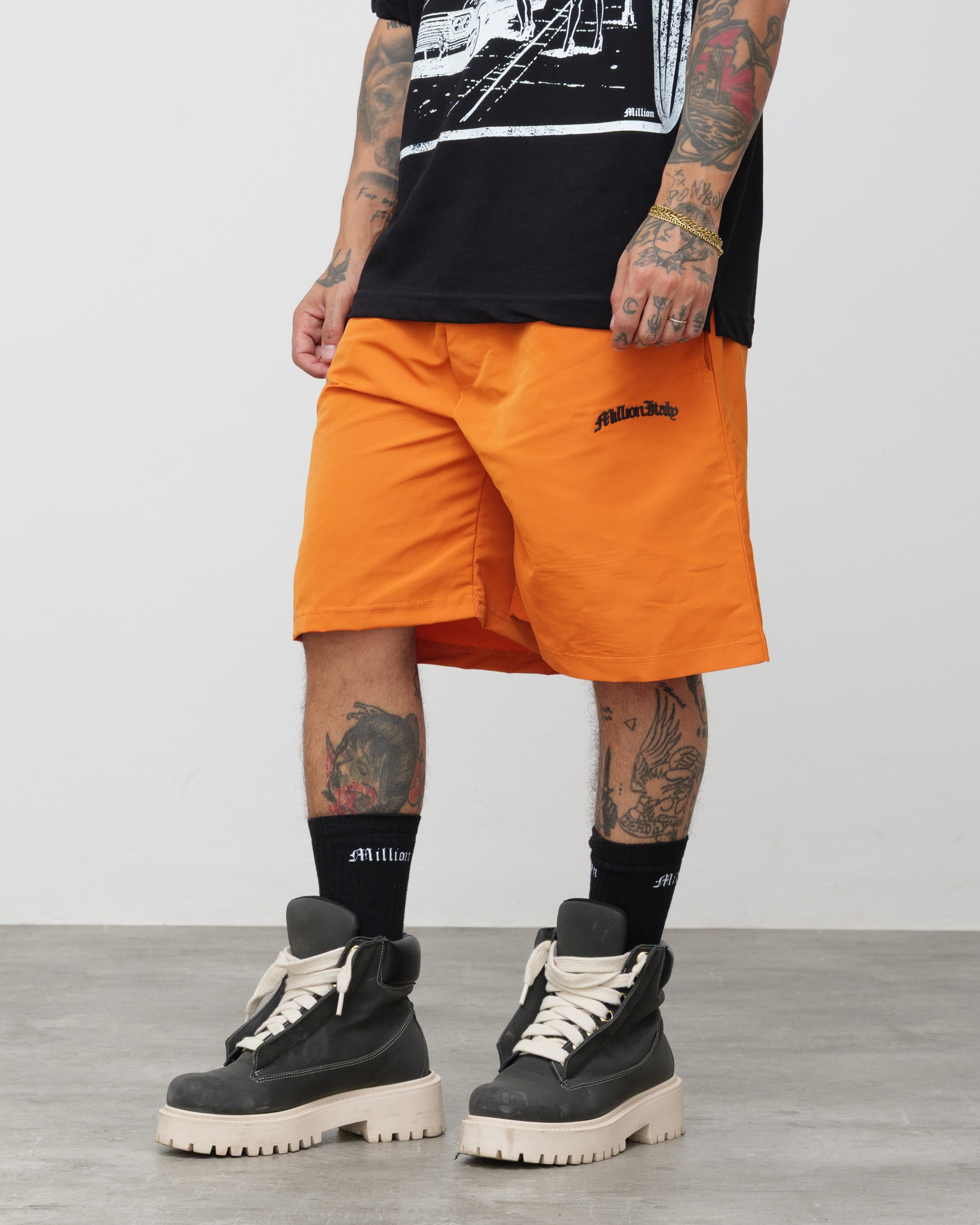 Shorts Tech Arancio - Logo Nero